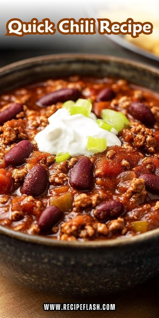 chili recipe in a bowl with sour cream on top