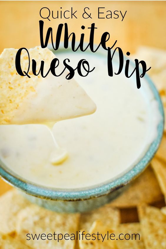 white queso dip in a glass bowl with tortilla chips