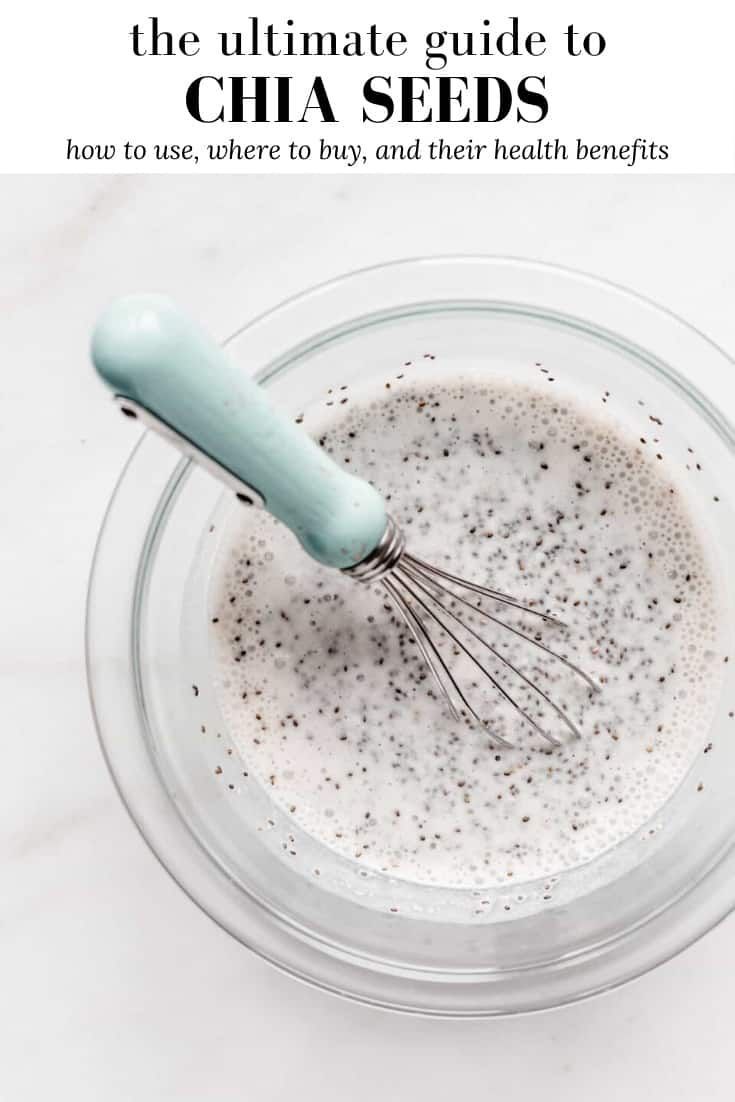 the ultimate guide to chia seeds in a glass bowl with a whisk