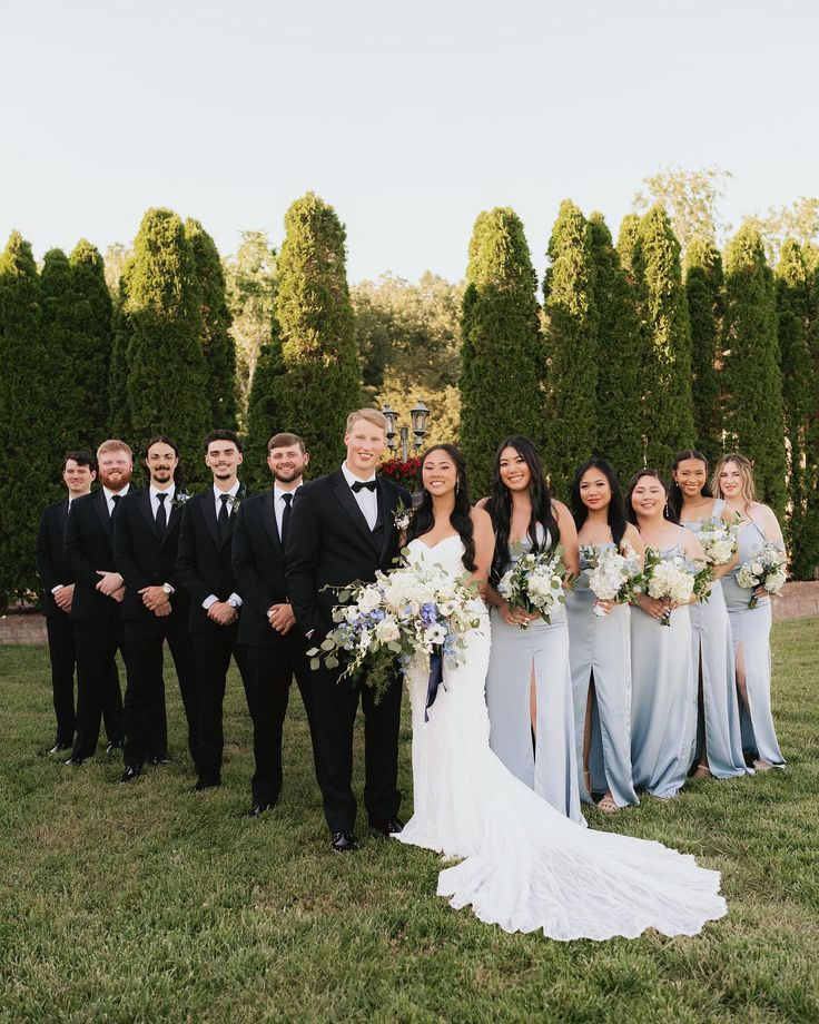 a bride and groom with their bridal party