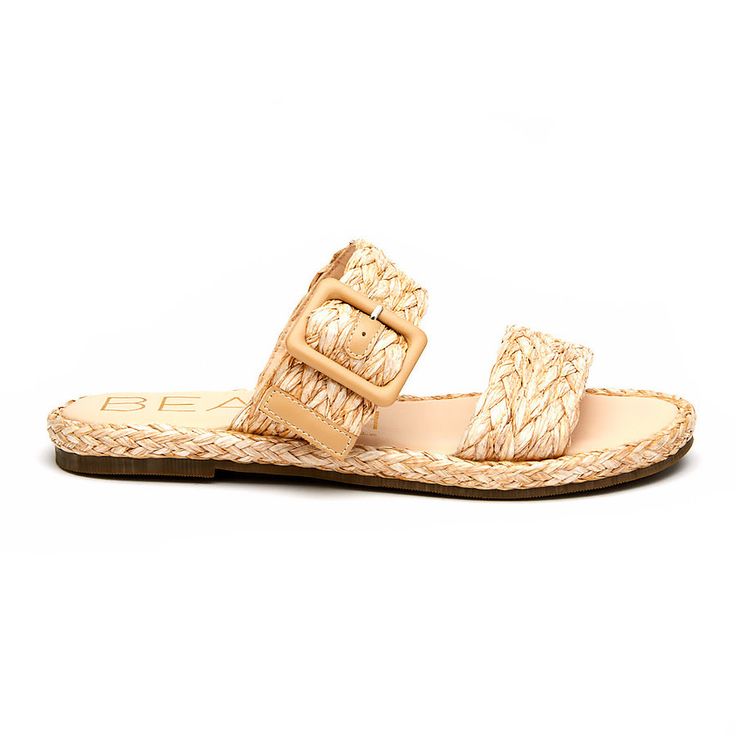 Slip on sandals with a cute, coastal vibe. Casual Sandals For Vacation In Natural Color, Casual Straw Sandals For Vacation, Casual Natural Sandals For Vacation, Beige Beach Sandals With Buckle Closure, Summer Sandals In Natural Straw, Natural Straw Sandals For Summer, Trendy Natural Straw Sandals, Adjustable Flip Flops With Woven Sole For Beach, Natural Straw Summer Sandals