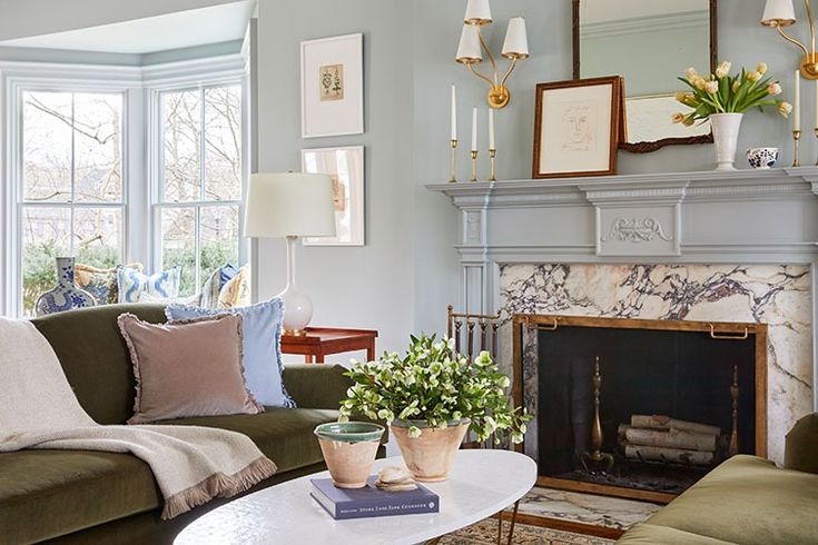 a living room filled with furniture and a fire place