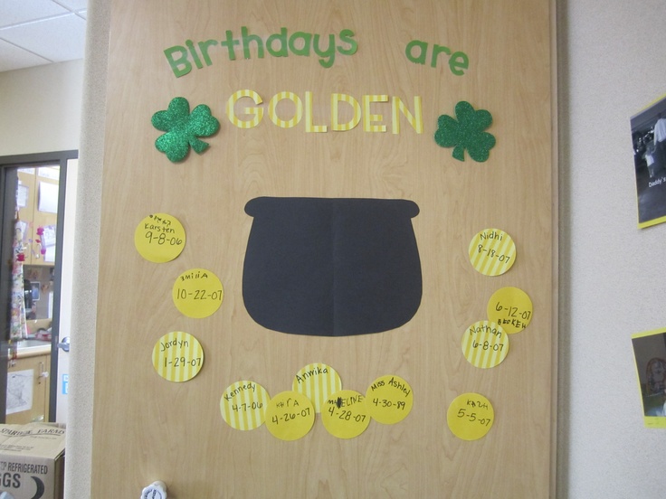 a bulletin board with the words birthdays are golden written on it and shamrocks