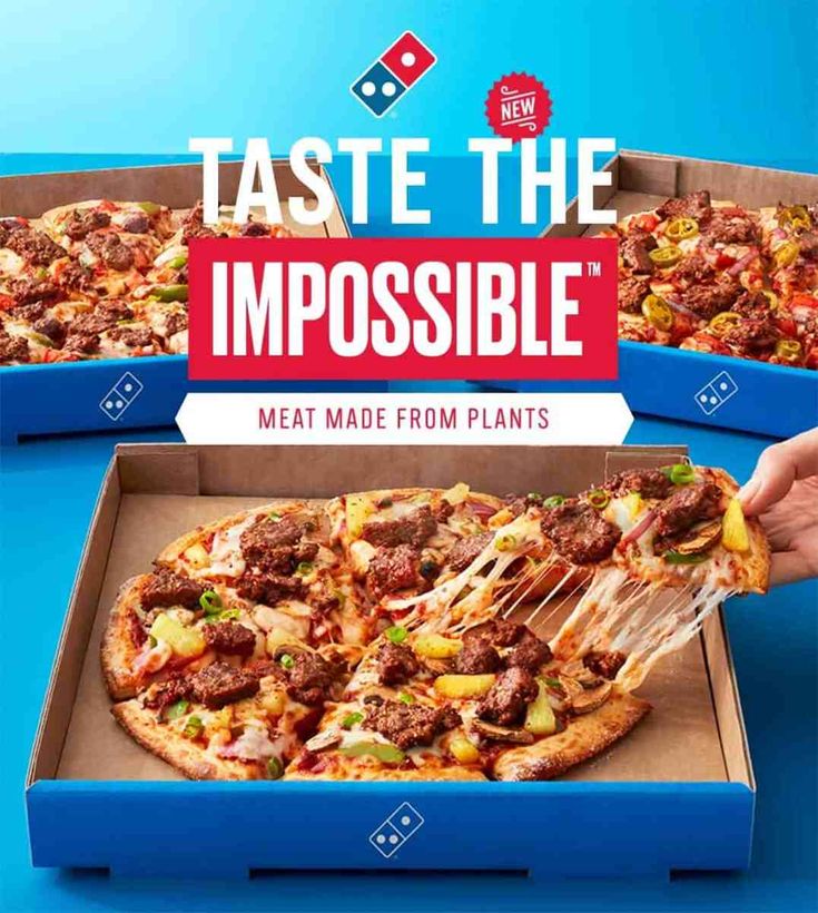 two boxes of pizza with the words taste the impossible meat made from plants