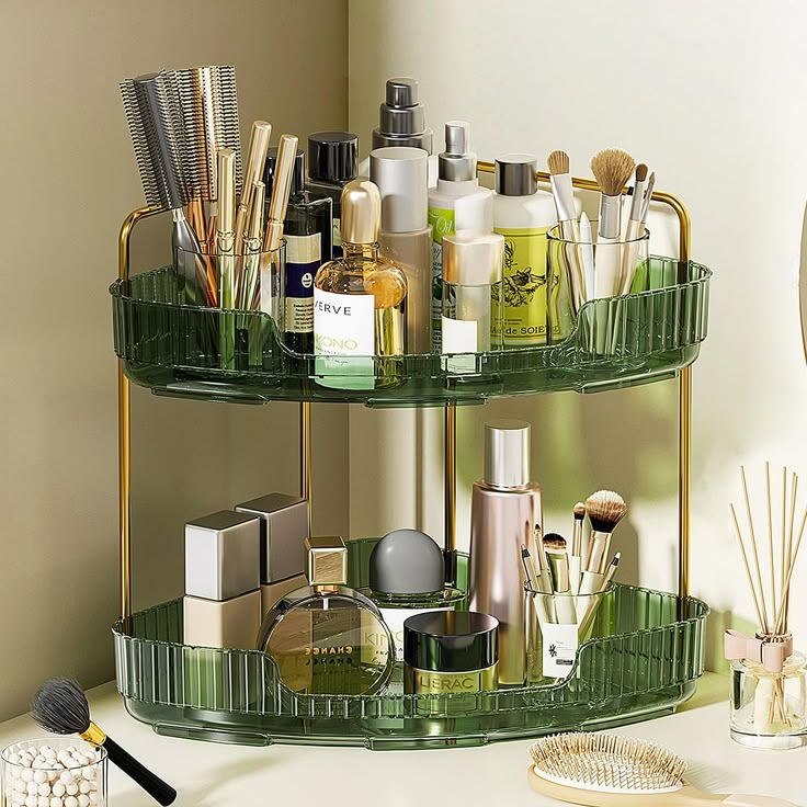 two tiered green shelf with cosmetics and personal care items on it next to a mirror