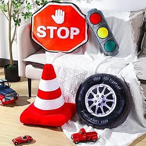 a red stop sign sitting on top of a white chair next to a pile of toy cars