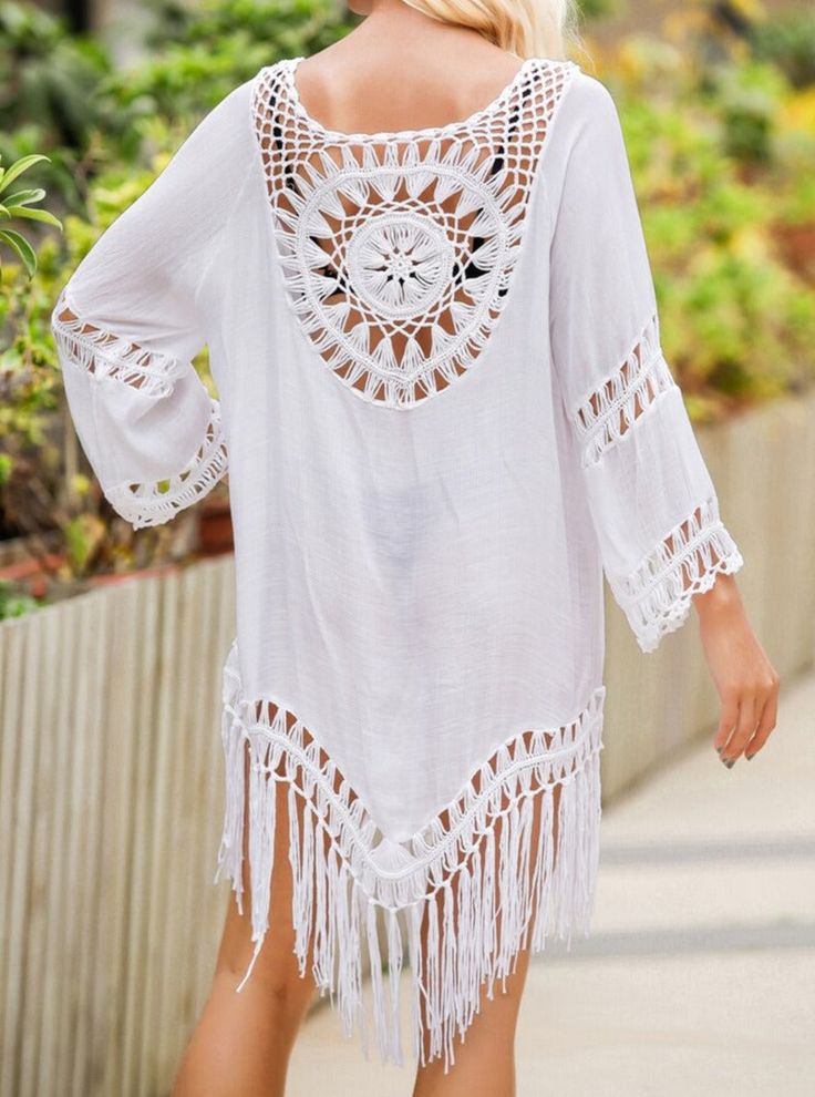 This stylish Beach Tunic is the perfect companion for your pool days. Crafted with resort style fringe knit design, its lightweight construction allows for maximum breathability and comfort. Perfect for lounging by the poolside, this tunic is sure to be a favorite! Style: Boho Chic Pattern Type: Solid Material: Nylon, Polyester, Rayon, Cotton White Cover-up For Beach Season, Casual White Cover-up With Crochet Trim, Long Sleeve Pool Cover-up For Beachwear, Long Sleeve Beachwear Cover-up For Pool, Long Sleeve Beachwear Cover-up, Casual V-neck Cover-up With Tassels, Summer Long Sleeve Pool Cover-up, Summer Long Sleeve Cover-up For Pool, Long Sleeve Summer Cover-up For Pool