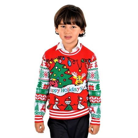 a young boy wearing an ugly holiday sweater and black pants, standing in front of a white background