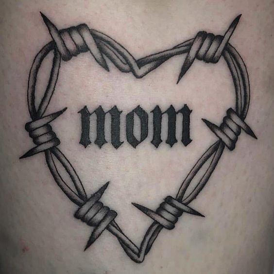 a heart with barbed wire and the word mom on it