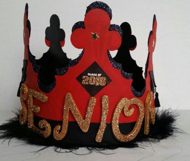 a red and black crown with gold letters on it