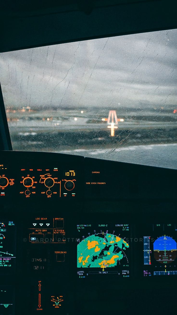 the view from inside an airplane cockpit at night