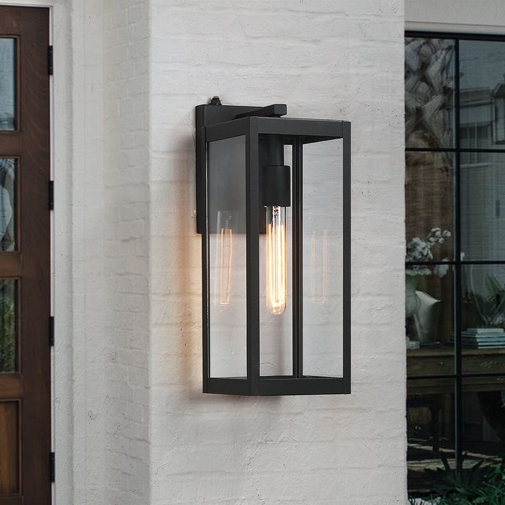 16.5 inch outdoor wall lantern sconce light fixture, it's a contemporary beauty yet functional. Powder-coated black finish. This ambient outdoor sconce lighting is a decorative wall-mounted fixture that provides a beautiful light for entryway, doorway, foyer, corridor, balcony, patio and porch. It features a dusk to dawn auto sensor which enables the fixture to automatically turns on at dusk and turns off at dawn True Fine Spun 1-Light 16.5-in Black Outdoor Wall Light | TD130003OT Front Door Lighting, Outdoor Wall Light Fixtures, Wall Mount Lantern, Black Outdoor Wall Lights, Led Outdoor Wall Lights, Garage Lighting, Outdoor Sconces, Outdoor Wall Lantern, Dusk To Dawn