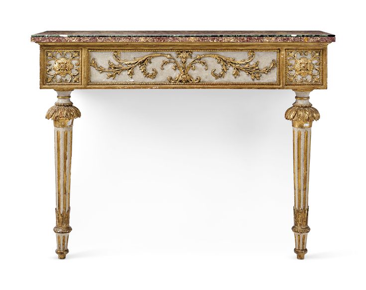 an ornately decorated console table with marble top