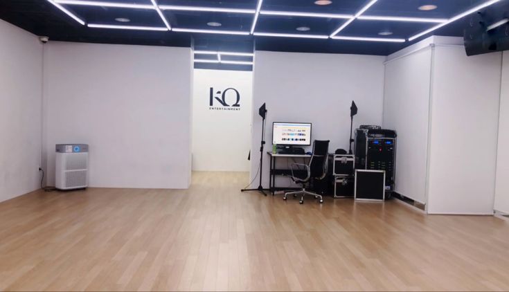 an empty room with speakers and other equipment