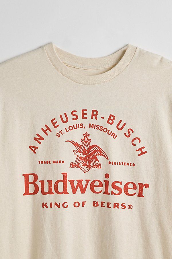 Tee with Budweiser graphics printed at the front. Cotton jersey t-shirt in a standard fit with short sleeves & a ribbed knit crew neck. Features Budweiser graphic tee Regular fit Short sleeves Crew neckline Content + Care 100% Cotton Machine wash Imported Size + Fit Measurements taken from size Medium Chest: 21" Length: 28" | Budweiser King Of Beers Tee in Ivory, Men's at Urban Outfitters Bar Shirt, College Shirts, Shirt Design Inspiration, Screen Printing Shirts, Graphic Tees Vintage, Graphic Tee Design, Tee Shirt Designs, Beer Shirts, Branded Shirts