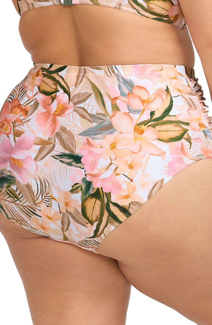 A powermesh lining provides comfortable support in bikini bottoms designed with a tropical print and full back coverage perfect for sunny pool days. Full back coverage Powermesh lining 82% recycled nylon, 18% elastane Hand wash, dry flat Imported Tropical Tie-side Bottoms With Floral Print, Stretch Floral Print Bottoms For Beach Party, Tropical Floral Print Tie-side Bottoms, High Waist Tropical Print Swimwear For Beach, High Waist Printed Swimwear For Beach, Printed High Waist Swimwear For Beach, Floral Print Stretch Swimwear With Tie-side Bottom, Tropical Style Printed Tie-side Bottoms, Tropical Stretch Swimwear With Tropical Print