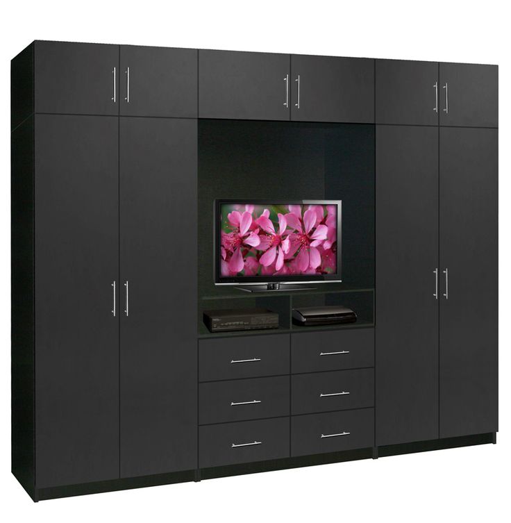 a black entertainment center with pink flowers on the tv screen and two large cabinets in front