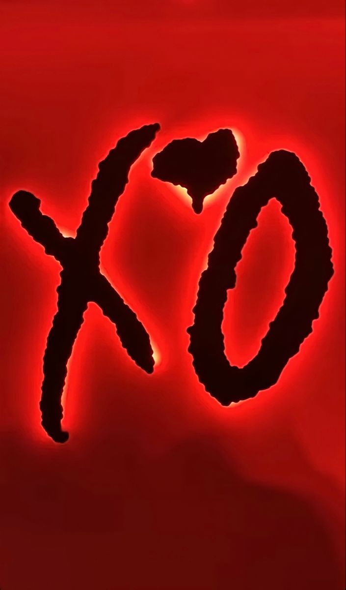 the word xo is written in black on a red background with an orange glow