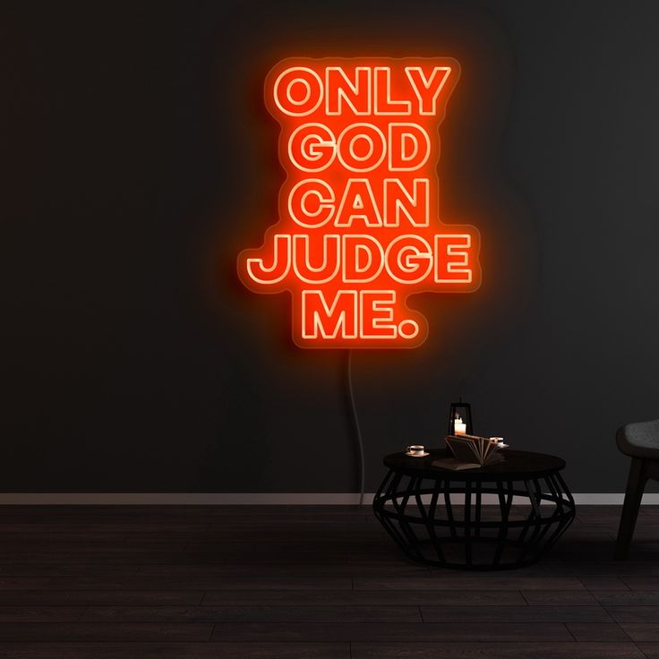 a neon sign that says only god can judge me on the side of a wall