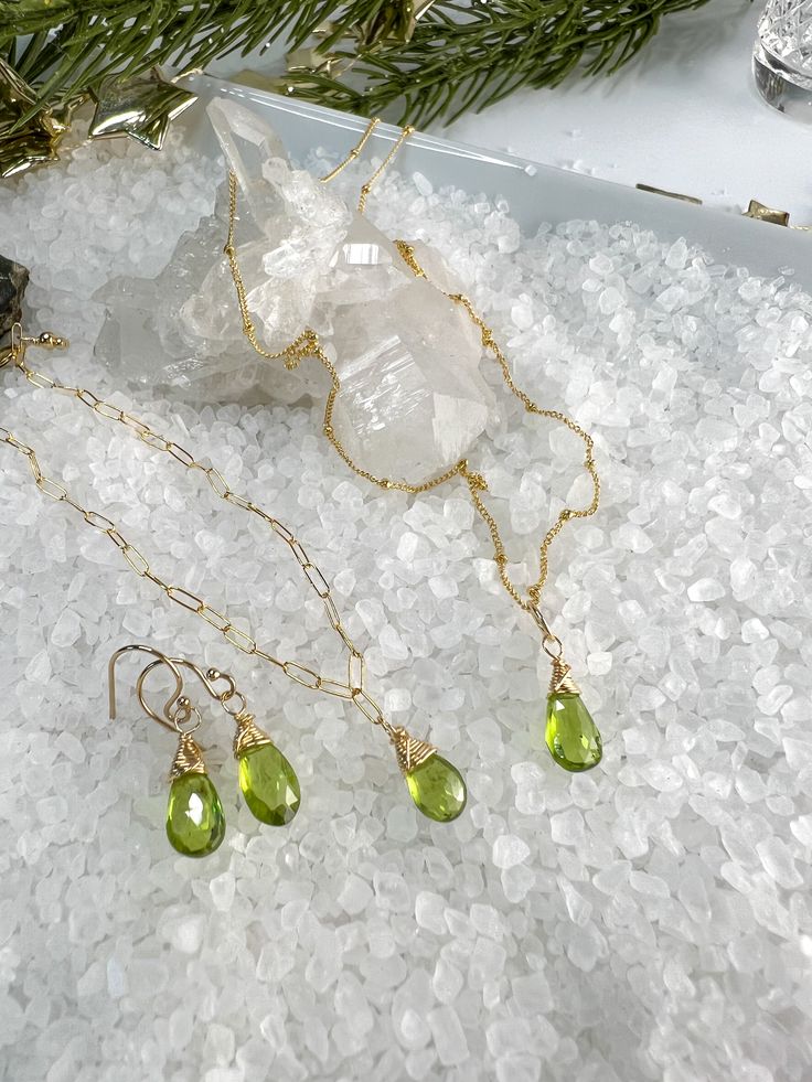 🌴 VACATION ALERT 🌴 I will be on vacation from 8/8-8/23. If you place an order after 8/5, it WILL NOT SHIP UNTIL 8/25.Beautiful faceted Peridot Briolettes are hand wrapped in the pretty matching set.Necklace measures 18".Bracelet measure 7" & can be shortened on any of the links.Earrings dangle from gold filled ear wires & include silicon ear backs.Beautiful set for those August Birthdays, lovers of Green, or St. Patrick's Day! Gold Peridot Jewelry For May Birthstone, Gold Peridot Jewelry With Gemstone, Gold Peridot Gemstone Jewelry, Peridot Faceted Beads Jewelry Gift, Peridot Faceted Jewelry For May Birthstone, Faceted Peridot Jewelry For May Birthstone, Handmade Peridot Dangle Jewelry, Green Peridot Wire Wrapped Jewelry, Lime Green Jewelry With Matching Earrings For Gift