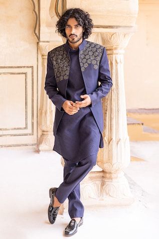 Navy blue bandhgala with placed sequins hand embroidery. Paired with a plain long kurta and a matching pant. - Aza Fashions Bandhgala Straight Kurta For Diwali Reception, Diwali Reception Bandhgala Straight Kurta, Nehru Jacket For Eid Reception Straight Kurta, Nehru Jacket For Eid Reception, Straight Kurta Style, Fitted Nehru Jacket With Mirror Work For Festive Season, Festive Fitted Nehru Jacket With Mirror Work, Fitted Mirror Work Bandhgala Designer Wear, Designer Mirror Work Bandhgala, Fitted Bandhgala With Mirror Work And Traditional Drape