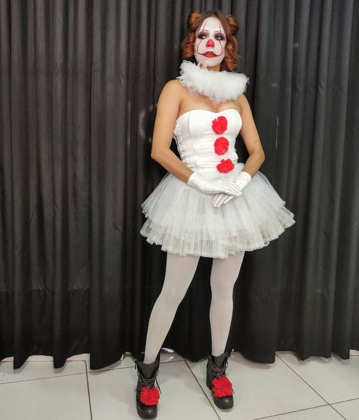 a woman dressed as a clown posing for the camera