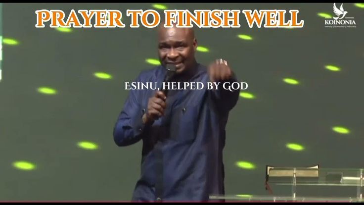 a man holding a microphone in front of a screen with the words prayer to finish well