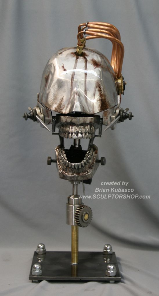 an old fashioned machine with a skull on it's head and some wires coming out of the top