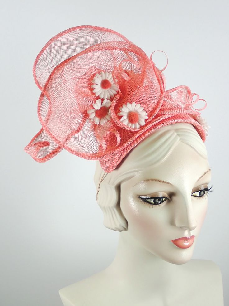 This women's peach/coral fascinator hat is a sure bet for Kentucky Derby or Kentucky Oaks. Or any summer event really, like church, ladies tea, or just for fun. It is made with sinamay straw and is very light and airy. The hand sculpted sinamay sits atop a handmade bandeau base and is secured with an elastic band that goes behind the ears and head to keep the hat in place. It is topped with vintage daisies and hand rolled sinamay leaves as well as sinamay swirls for added texture. An inner grosg Sinamay Fascinator Hat For Spring, Spring Sinamay Fascinator Hat, Spring Sinamay Fascinator, Summer Beach Fascinator, Spring Fascinator With Sinamay And Curved Brim, Spring Adjustable Sinamay Fascinator, Spring Sinamay Mini Hats For Races, Brimmed Beach Fascinator For Summer, Brimmed Summer Beach Fascinator