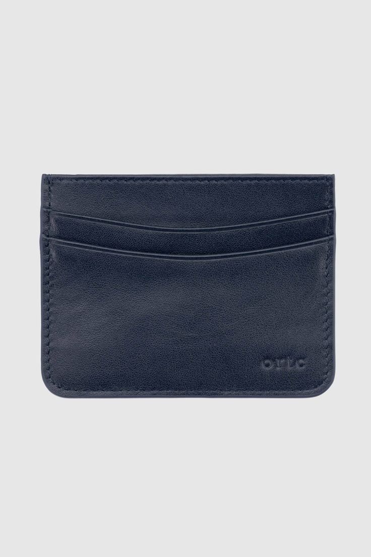 Leather cardholder Navy blue leather with striped interior lining 5 card sleeves Debossed ortc logo Comes in navy blue gift box Size: [W] 10.5cm [H] 8cm Handmade Designed in Australia. Made in China Classic Blue Card Holder For Business, Classic Blue Business Card Holder, Classic Blue Wallets With Card Slots, Classic Blue Card Holder For Everyday Use, Classic Blue Wallet With Card Slots, Blue Classic Card Holder For Everyday Use, Blue Elegant Card Holder With Rfid Blocking, Elegant Blue Rfid Blocking Card Holder, Classic Blue Wallets With Rfid Blocking