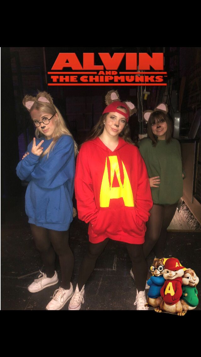 three girls in costumes standing next to each other