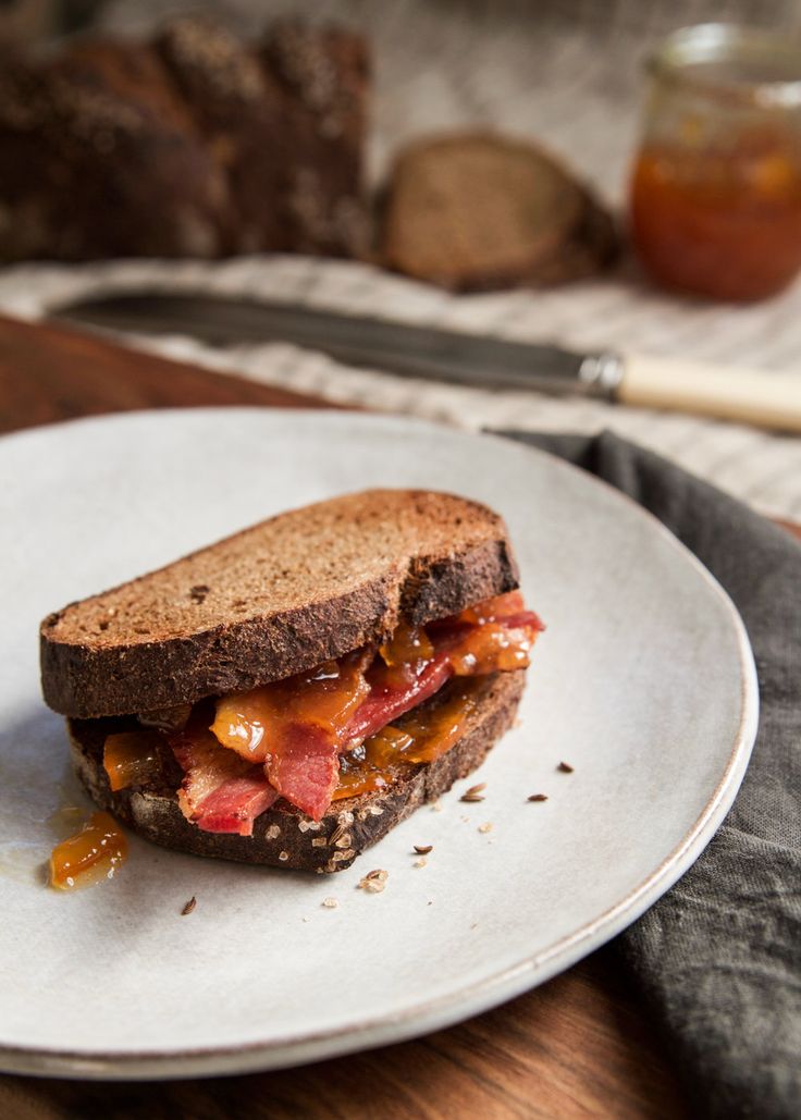 a sandwich is sitting on a white plate