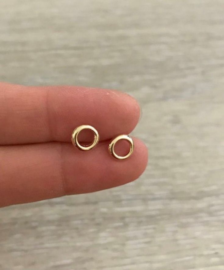 Open Circle Studs * 1 pair * 14k Gold * Size: 7 mm * Made in U.S.A. 14k Gold-filled Yellow Gold Cartilage Earrings, 14k Gold Everyday Cartilage Earrings, Dainty Gold Plated Cartilage Earrings For Gifts, 14k Gold Circular Earrings, 14k Rose Gold Cartilage Earrings With Matching Set, Rose Gold 14k Gold Matching Cartilage Earrings, Gold 14k Gold Filled Cartilage Earrings, 14k Gold Filled Gold Cartilage Earrings, 14k Gold Dainty Nickel-free Cartilage Earrings