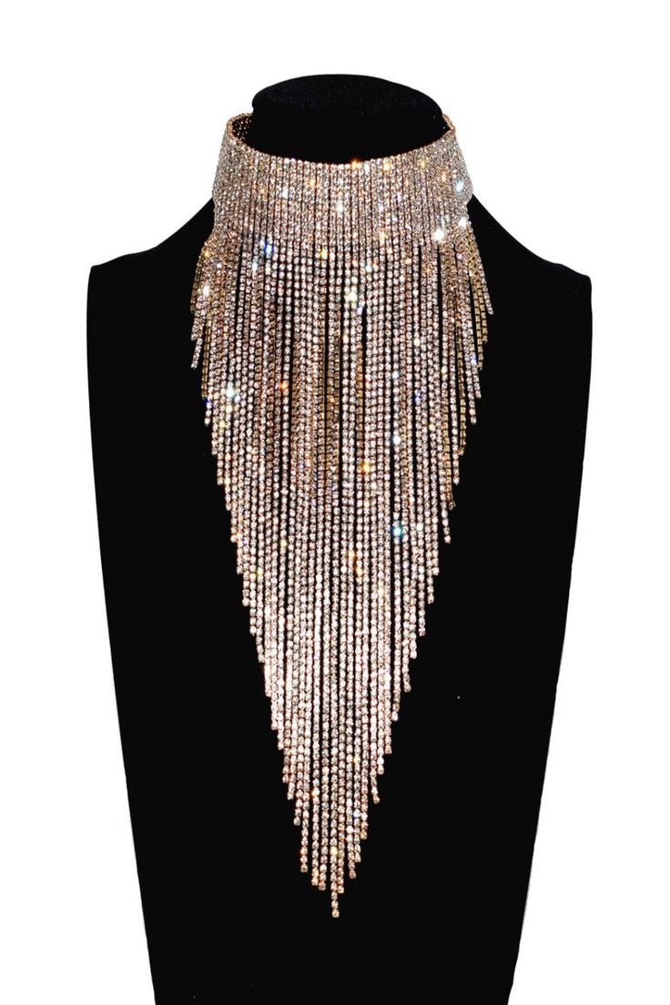 Say goodbye to dull, boring necklaces! Your days are finally over with this statement necklace made of sparkling rhinestone crystals. It's a lightweight accessory that sparkles like crazy and will make you shine like the true diva you are. Long Tassel Coller Necklace made from environmentally friendly material , nickel-free, lead-free, and hypoallergenic. It's safe for sensitive skin This is the ultimate statement quartz crystal necklace for making a big impression. And it's not just about the b Luxury Statement Clavicle Chain Necklaces, Black Dress Diamond Choker, Luxury Statement Choker Jewelry, Luxury Statement Long Necklace For Parties, Cheap Gold Rhinestone Statement Necklace, Luxury Jeweled Necklaces For Festivals, Luxury Chain Necklace For Fashion Statement, Luxury Unique Necklaces For Festivals, Luxury Clavicle Chain Necklace For Parties