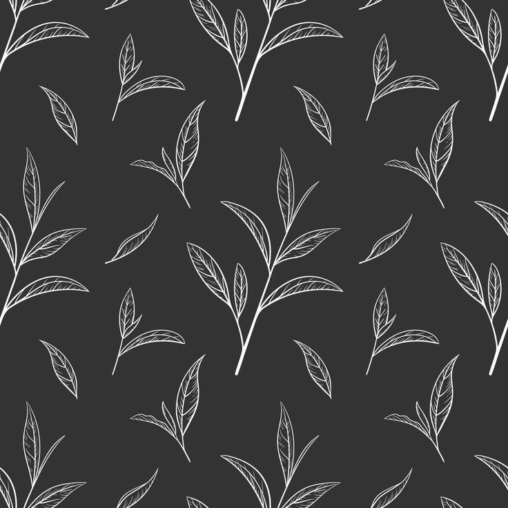 a black and white pattern with leaves