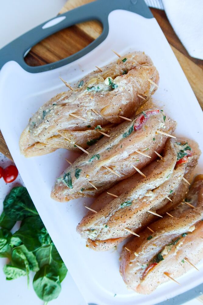 some food is on a white plate with toothpicks