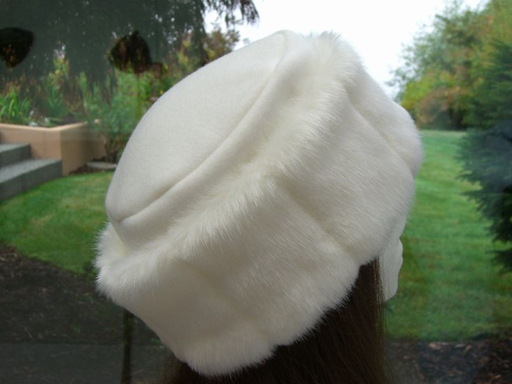 This warm and pretty faux fur hat is the perfect hat for any season. I made it with super soft creamy white mink faux fur and a double layer of creamy white fleece for warmth and comfort. It is sized to fit most adults 21.5 - 23 inches around head. Spot clean or dry clean. Creamy white, beautiful brown, pretty pink and rich black mink faux fur are also available...email me with your choice. If a larger or smaller size is required, email me with your size. White Fur Hat, Fashion Network, Faux Fur Hat, Trendy Hat, White Fleece, Fur Hat, White Fur, White Faux Fur, Fur Fashion