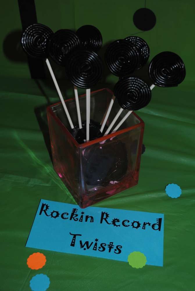 there are some black and white pins in a square container with the words rockin'record twists on it