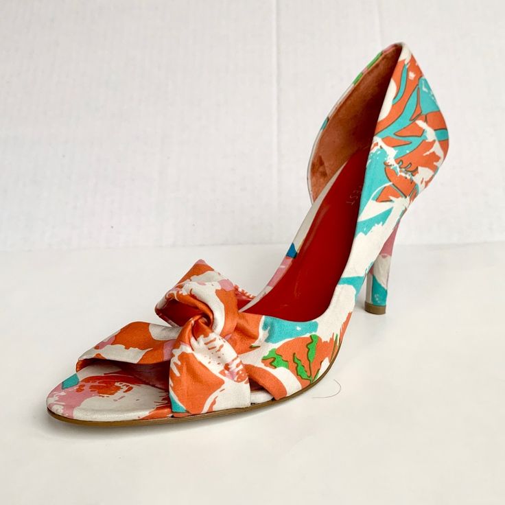 Beautiful Open Toe Heels With Partial Side Opening And Tie Detail In The Front Colors Of Teal, Organs, Pink, Blue And Green Over A White Base Heel Height: 4” New Never Worn 93 Multicolor Fitted Heels For Spring, White Fabric Open Toe Heels, White Fabric High Heels, Spring Multicolor Fitted Heels, Colorful Pointed Toe Heels For Summer, Multicolor Fabric Open Toe Heels, White Retro Heels For Summer, White Retro Summer Heels, Multicolor Floral Print Heels With Round Toe