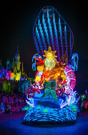 an amusement park ride lit up at night