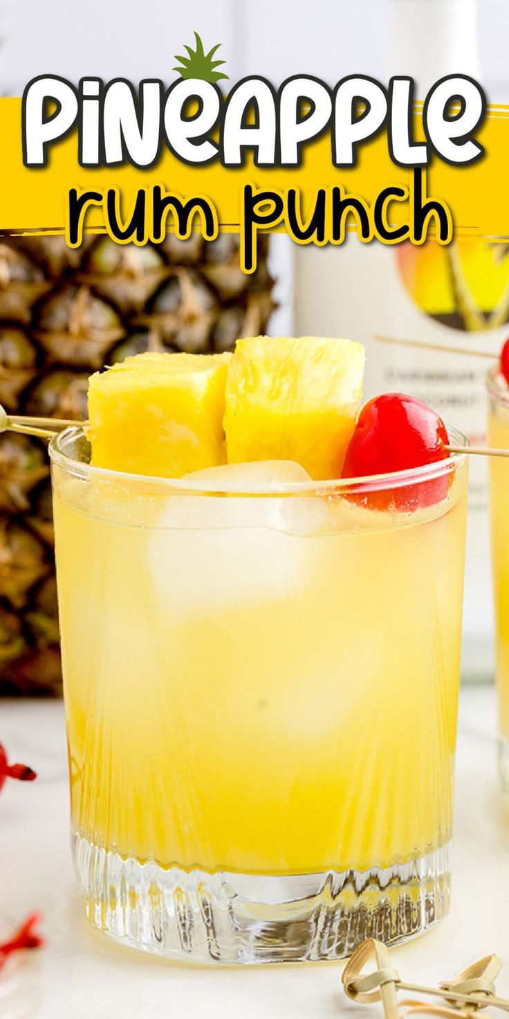 the pineapple rum punch is garnished with cherries