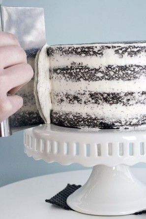 a person cutting a cake with a knife