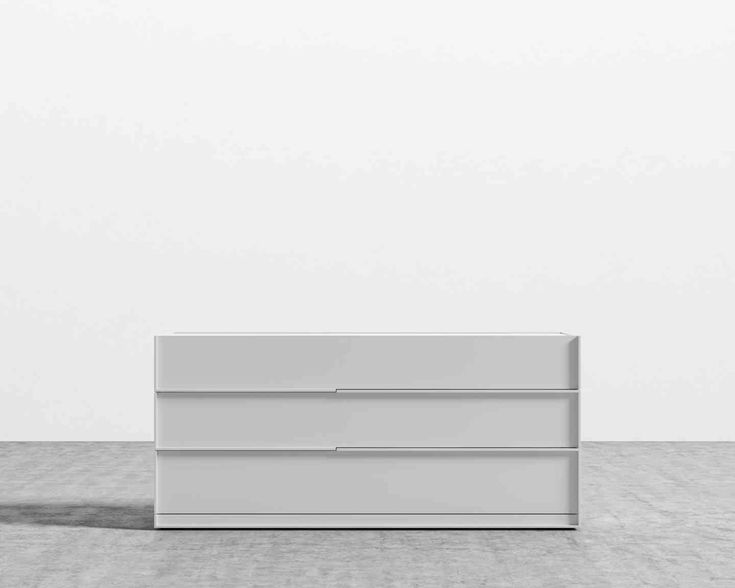 an empty white cabinet sitting on top of a floor