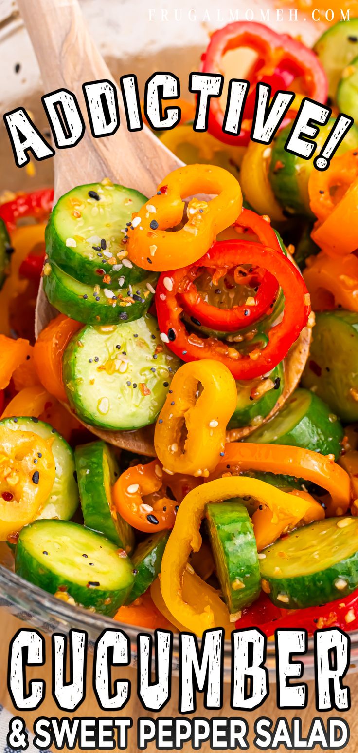 a bowl filled with cucumber and red pepper salad on top of a wooden table