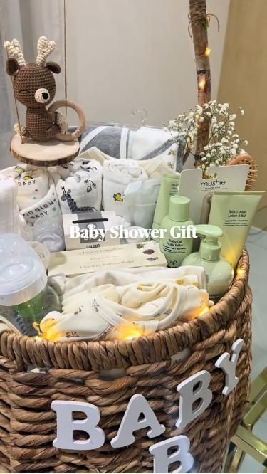 a baby shower basket with items in it