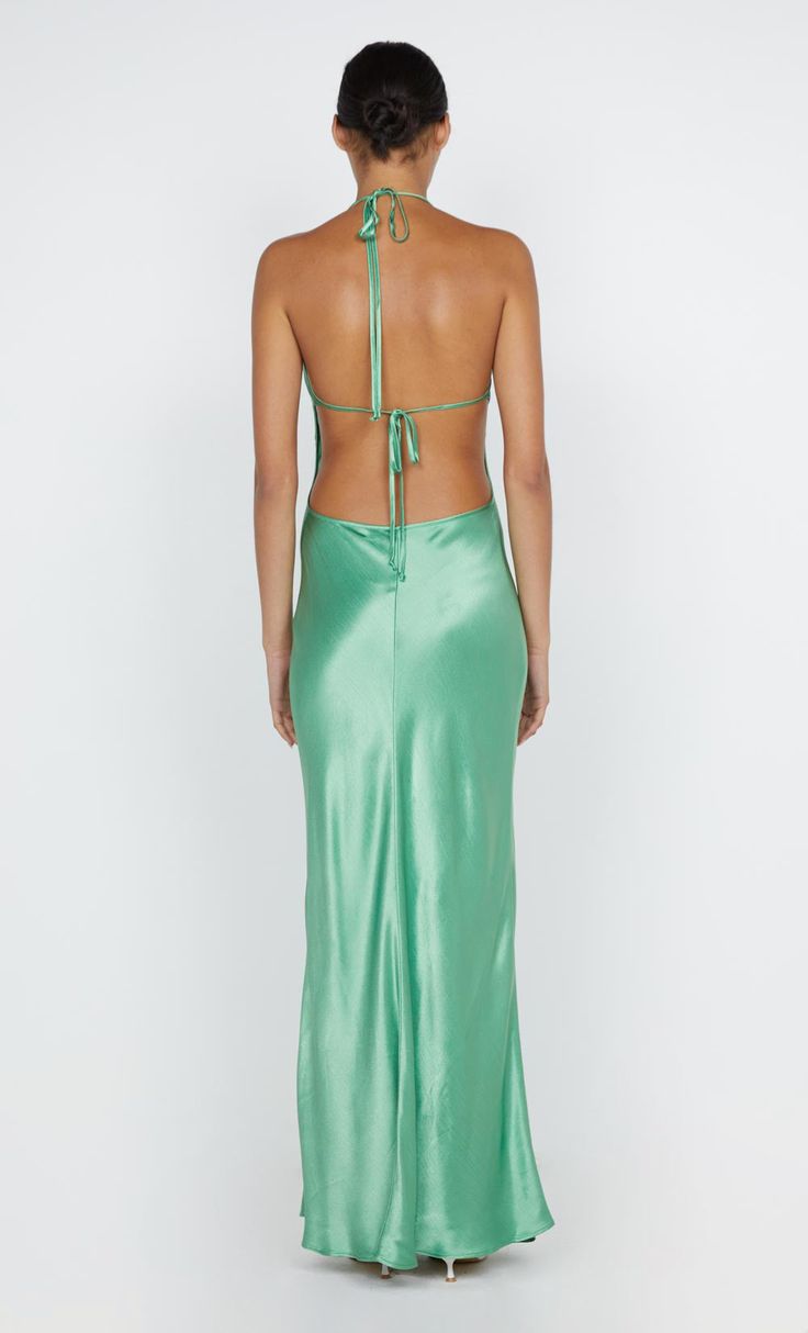 Designed in a flattering silhouette, the BEC + BRIDGE Zariah Halter Dress is cut from a lustrous fabric. The dress features a deep V and a statement halter neckline that ties above an open back. This product is certified Australian made. Green Backless Dress With Lace-up Back, Green Dress With Back Opening For Party, Green Tie Back Dress For Night Out, Green Tie-back Dress For Night Out, Satin Maxi Dress With Tie Back, Green Tie Back Midi Dress For Night Out, Green Tie-back Midi Dress For Night Out, Silk Halter Neck Backless Dress For Gala, Backless Slip Dress For Spring Gala