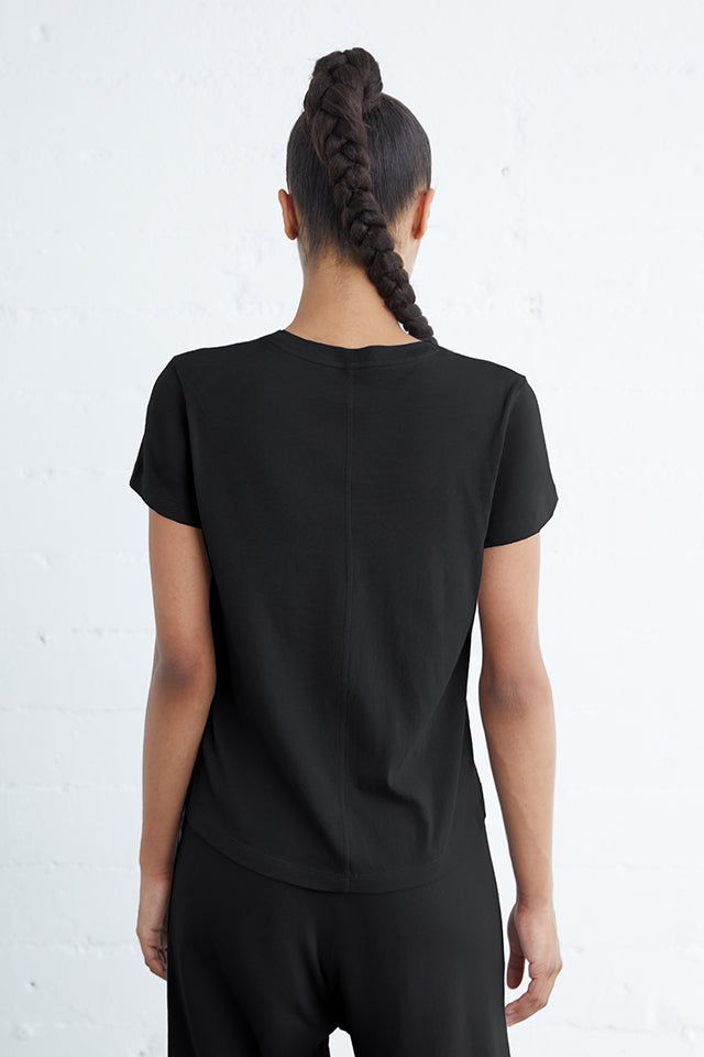 The Melrose Tee is an essential addition to any wardrobe, boasting a soft fabric that provides comfort and style. Featuring a center back seam and triangle insets at the hem, this shirt offers a perfect fit for all body types. Upgrade your t-shirt game with the Melrose Tee. 100% Cotton Models are 5'8" and wearing a size small Sporty Scoop Neck T-shirt For Everyday, Sporty T-shirt With Relaxed Fit And Shirttail Hem, Versatile T-shirt With Shirttail Hem, Soft-washed Relaxed Fit T-shirt For Athleisure, Relaxed Soft-washed T-shirt With Shirttail Hem, Effortless Stretch Tops For Everyday, Cotton Athleisure Tops With Scoop Neck, Effortless Crew Neck Stretch Tops, Relaxed Fit Soft-washed T-shirt With Scoop Neck