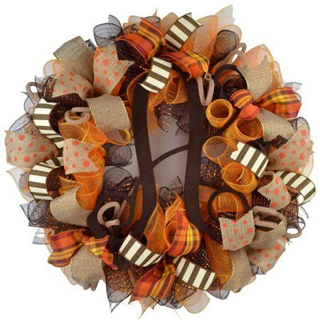 an orange and brown wreath with letters on it