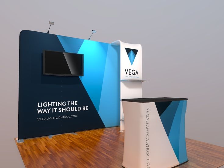 an exhibit stand with a television on the wall and a sign that says lighting the way it should be