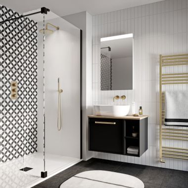 a modern bathroom with black and white tiles on the walls, flooring and shower